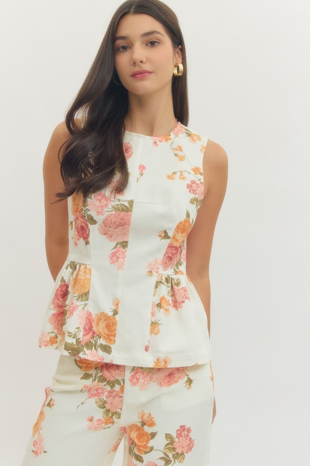 Floral print sleeveless peplum top