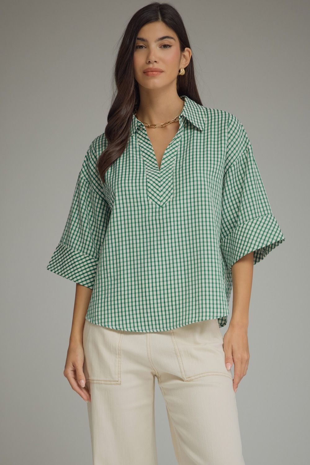 Gingham 3/4 sleeve top featuring V-neck collar detail