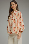 Floral print long sleeve top featuring shirring detail
